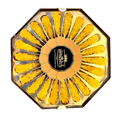 Octagonal box of saffron yellow rock candy stirrers arranged in a flower pattern, offering a sweet and luxurious touch for drinks or desserts.
